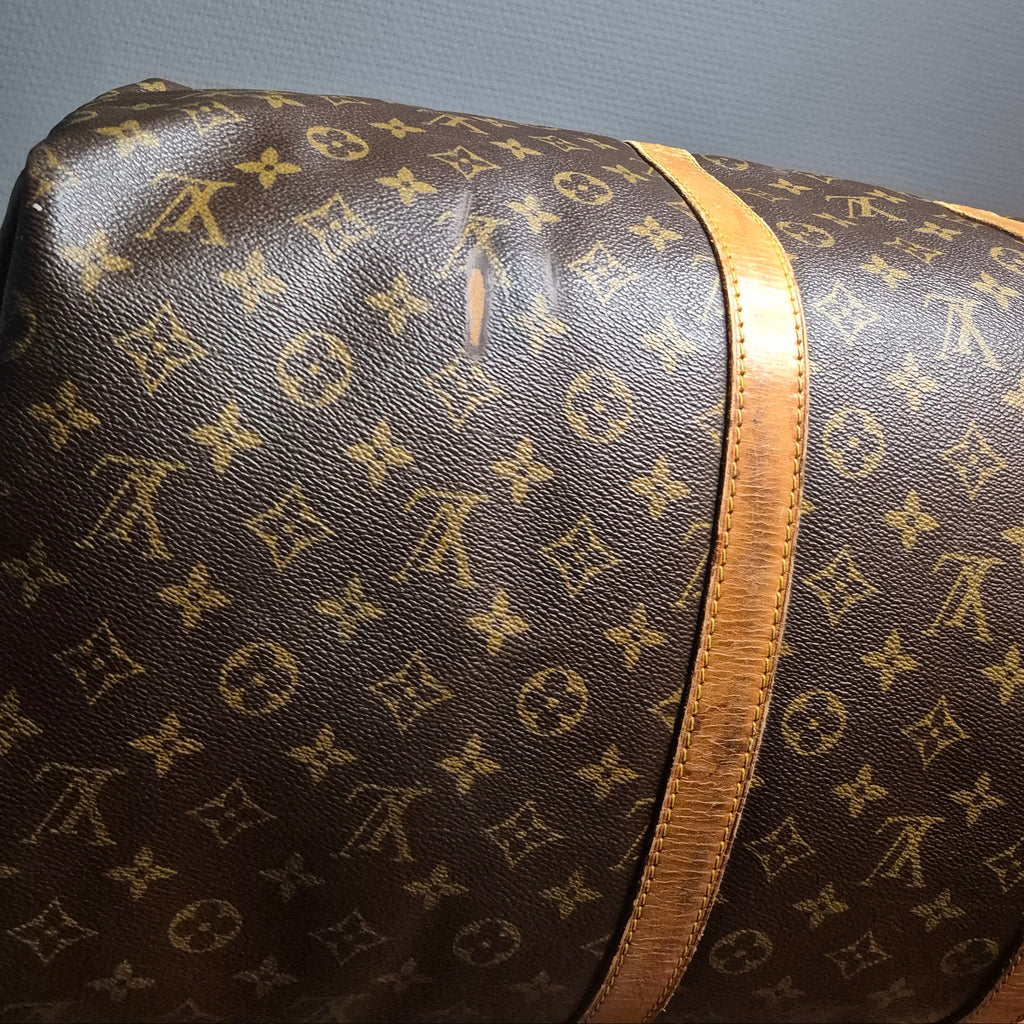 Louis Vuitton Keepall 55 Monogram vue defaut