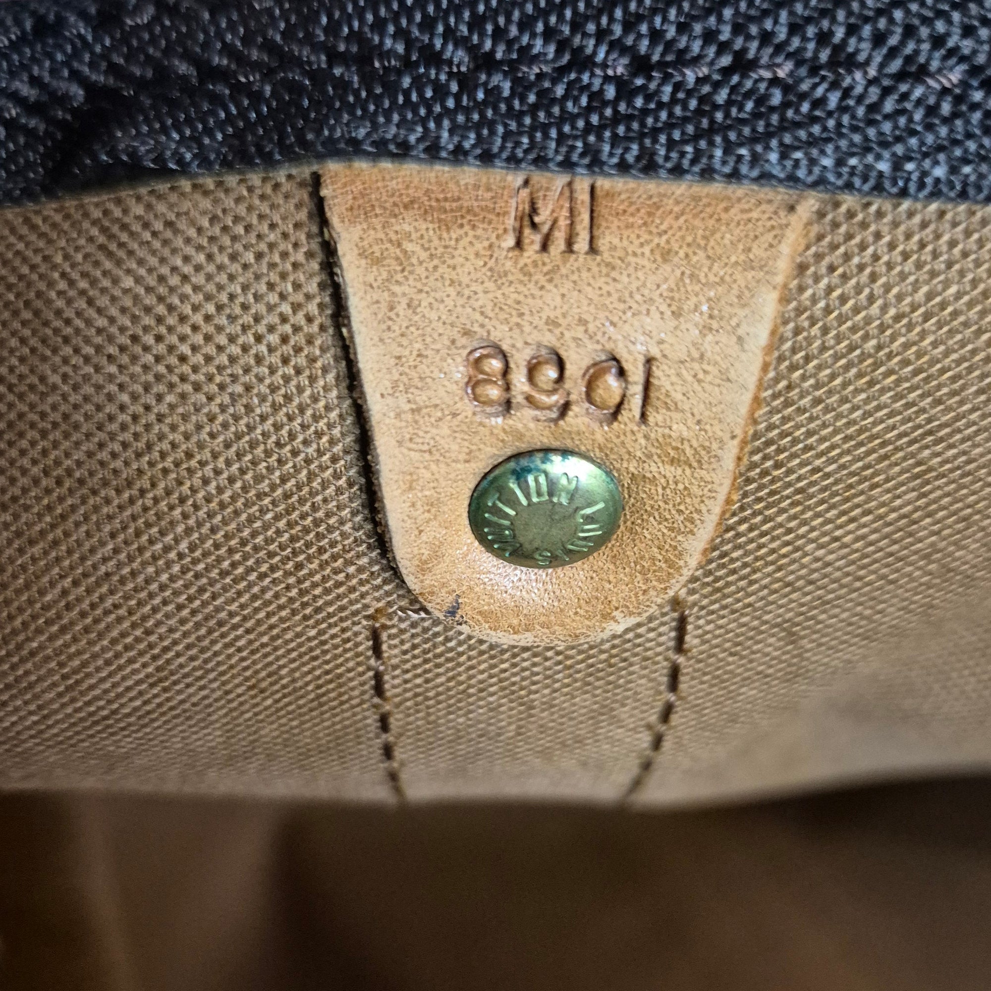 Louis Vuitton Keepall 55 Monogram vue code authenticité 