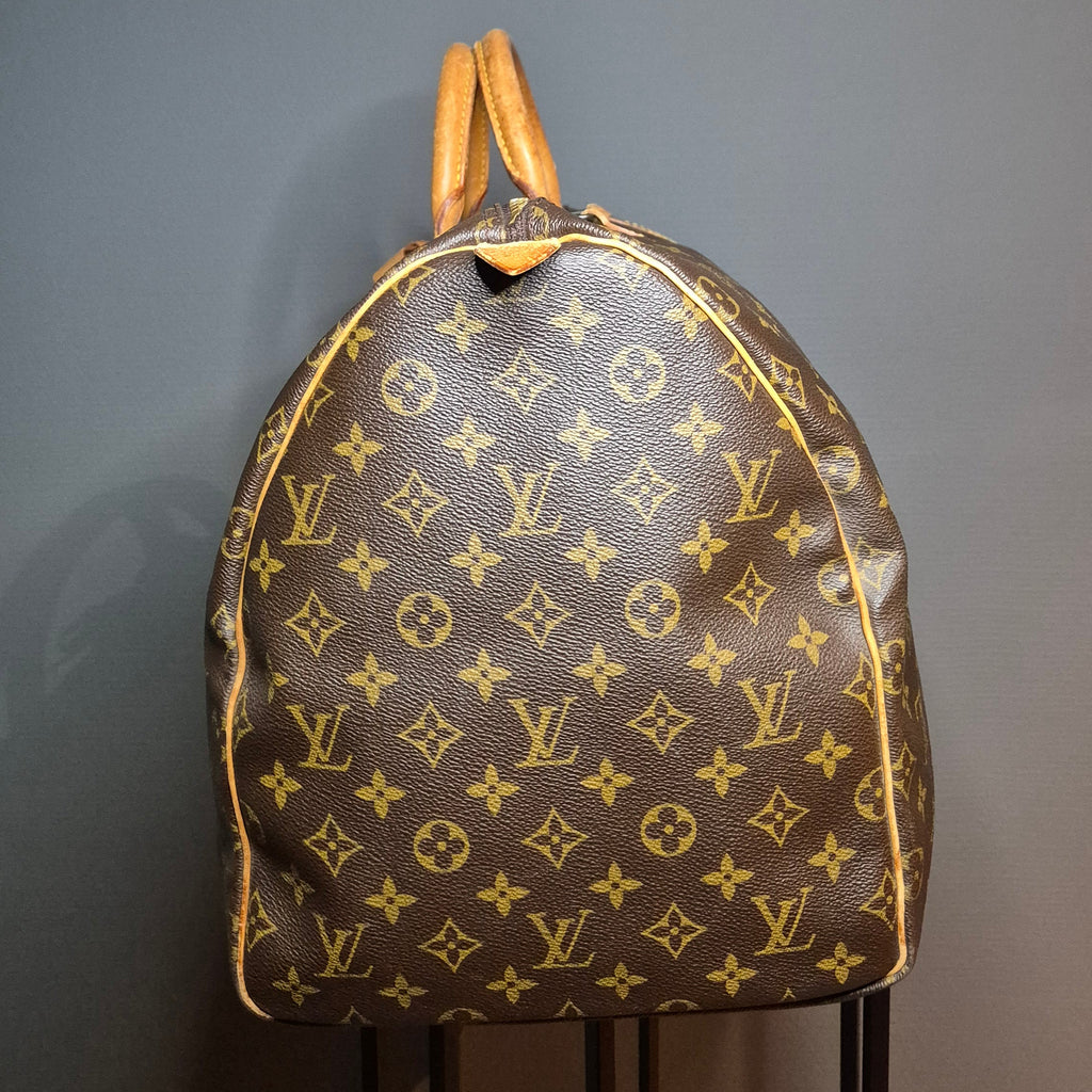 Louis Vuitton Keepall 55 Monogram marron côté gauche